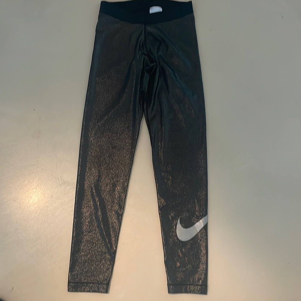 Nike women’s medium legging is shiny spandex